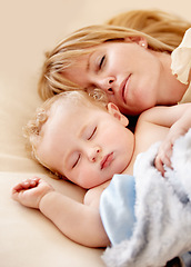 Image showing Sleeping, mom and baby with peace in bed together with calm moment with love for infant and kid in morning nap. Mother, cuddle and sleep with child in closeup and rest in bedroom or family home