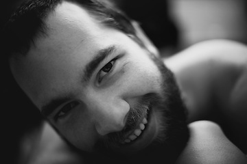 Image showing Portrait, smile and man in home, monochrome and relax in living room of apartment or house. Happy face of young person on black and white, dark and confident student on profile picture in Spain