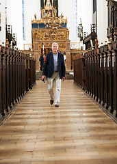 Image showing Walking, aisle and senior man in a church for sightseeing on a weekend trip, vacation or holiday. Portrait, religion and holy elderly male person in retirement in a worship cathedral in the city.