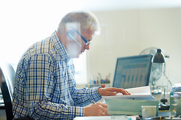 Image showing Senior, man and headset for communication in office with career in telesales, customer care or tech support. Male consultant, research and reading for review to improve company growth with feedback