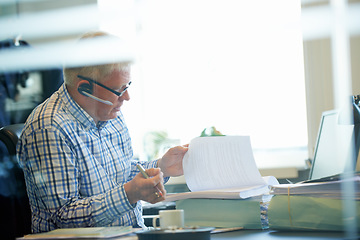 Image showing Man, paperwork and headset for communication in office for customer care, review or feedback for tech support. Male agent, call centre and consultation by technology, internet or online for telesales