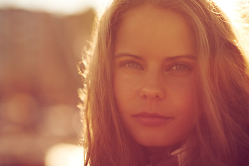 Image showing Portrait, beauty and woman outdoor at sunset on mockup space, holiday or travel on vacation. Face, serious and young person or girl in nature, confident and summer sunshine for freedom in Switzerland