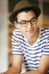 Image showing Nerd, man and thinking with a smile in home with ideas of future, growth and daydream with hope. Hipster, person and college student with fashion, wellness and remember a happy memory with peace