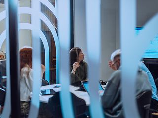 Image showing A diverse group of businessmen collaborates and tests a new virtual reality technology, wearing virtual glasses, showcasing innovation and creativity in their futuristic workspace