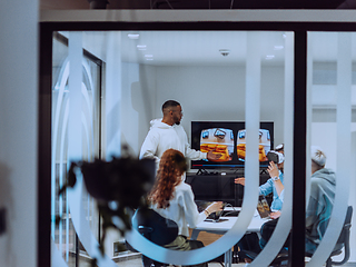 Image showing A diverse group of businessmen collaborates and tests a new virtual reality technology, wearing virtual glasses, showcasing innovation and creativity in their futuristic workspace