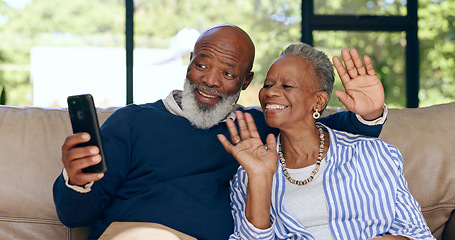 Image showing Happy senior couple, video call and smartphone in home for voip communication, social network or chat. African man, woman and wave hello for virtual conversation, mobile contact or talk in retirement