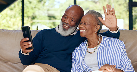 Image showing Video call, happy senior couple and phone in home for voip communication, social network or chat. African man, woman or wave hello on smartphone in virtual conversation, contact or talk in retirement