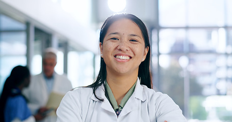 Image showing Doctor, woman and portrait with smile in hospital or clinic for healthcare, service or medical support. Medicine, asian person and professional with happy, confident and pride for career or wellness