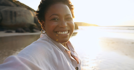 Image showing Woman, selfie and smile in portrait at beach, relaxing and peace for social media, post and update on holiday. Happy black person, face and ocean on vacation, getaway and travel, fun and freedom