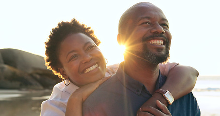 Image showing Couple, hug or smile on beach with love, bonding and sunlight for holiday, vacation and relationship. Black people, man or woman with embrace, happy or romance by ocean or sea for travel or adventure