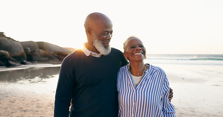 Image showing Senior couple, smile and hug on beach, love and bonding on vacation, holiday and trip to ocean. Happy black people, embrace and support or trust, commitment and connection in marriage or retirement