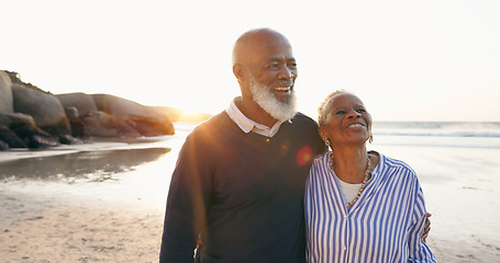 Image showing Senior couple, smile and hug by ocean, love and bonding on vacation, holiday and trip to beach. Happy black people, embrace and support or trust, commitment and connection in marriage or retirement