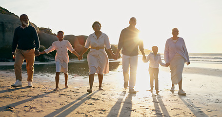 Image showing Family, fun and holding hands at beach, smile and support or trust, ocean and solidarity or care. Happy black people, sea and love or joy, bonding and water on vacation, holiday and laughing in sun