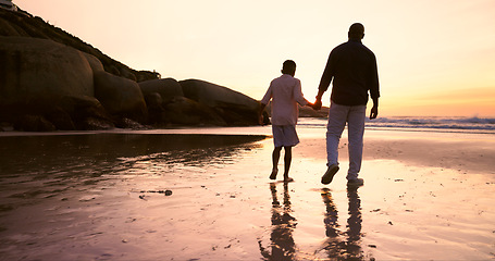 Image showing Father, son and holding hands at beach, sunset and support or trust, ocean and solidarity or care. Black family, sea and love or fatherhood, bonding and water on vacation, holiday and peace at dusk