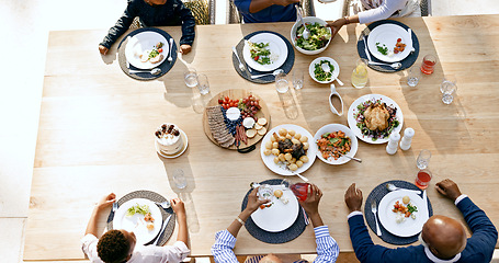 Image showing Table, happy family, and generations with food lunch, summer vacation and reunion together with love. Black people, grandparents, parents and kids at gratitude brunch, hands and above by cuisine