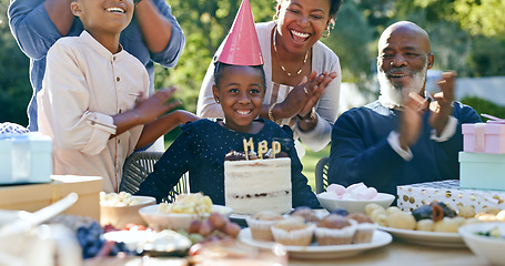 Image showing Family, birthday and applause at party with cake, celebration and excited or smile together in home. African parents, kids and clapping at event table outdoor with food, dessert and congratulations