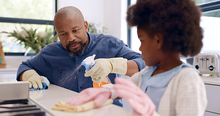 Image showing Kitchen counter, dad teaching or kid cleaning with teamwork, gloves or cloth to wipe off dirty table. Bacteria, child or girl learning to help father on messy surface in a family home with spray