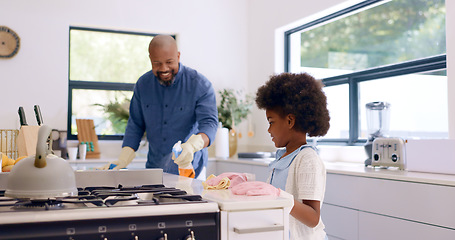 Image showing Father, girl and cleaning with gloves in kitchen for bonding, happiness and teaching in home or house. Black family, man and daughter with cloth, liquid detergent and table with smile, care and ppe