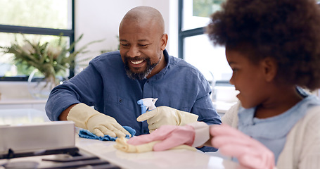 Image showing Father, daughter and cleaning with gloves in kitchen for bonding, happiness and teaching in home or house. Black family, man and girl child with cloth, liquid detergent and table with smile and care