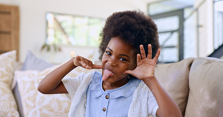 Image showing Funny, face and girl child with tongue out on a sofa for fun, playing or goofy personality at home. Crazy, hand gesture and portrait of African kid in living room with comic expression or silly mood