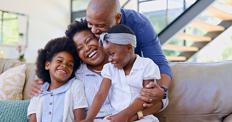 Image showing Happy family, children and hug on sofa in living room for bond, embrace and together. Black man, woman and girl with laugh for funny joke, story or memory with love, care and relationship in home