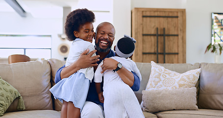 Image showing Love, hug and happy black family on a sofa with care, trust and bond at home together. Smile, embrace and excited girl children in a living room with father for support, security or weekend freedom