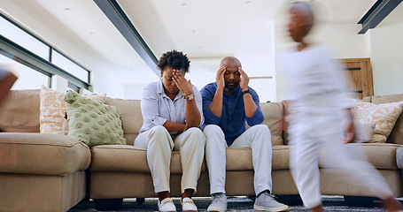 Image showing Running child, tired parents and headache on a sofa with stress, anxiety or fatigue at home. Family, chaos and frustrated people in a living room with hyper kid, burnout or overwhelmed by adhd energy