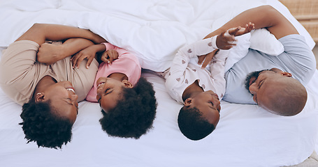 Image showing Bedroom, relax and black family parents, happy kids or people bonding, love and care young youth. Home wellness, happiness and African children, father and mother support, comfort and smile on bed
