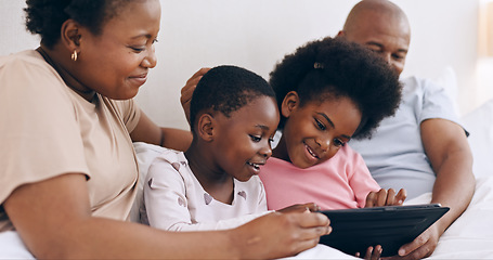 Image showing Children, parents and tablet in bedroom for online games, download multimedia and reading ebook. Mom, dad and black family of happy girl kids streaming digital movies, cartoon or subscription at home