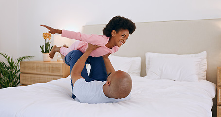 Image showing Bedroom, airplane and black family, father and happy child playing, having fun and enjoy fun flying game for home wellness. Bed, happiness and bonding dad, relax kid or girl imagine plane flight