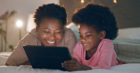 Image showing Mom, child and tablet in bedroom, watching cartoons and night time in bed, technology and laugh. Happy, enjoying and online for videos, digital and internet in home, streaming or bonding together