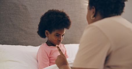 Image showing Mother, discipline and girl child in bedroom with strict parent talking or grounding to stop bad behaviour. Angry, family or frustrated African mom scolding a naughty kid with punishment in home