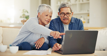 Image showing Senior, couple and planning on laptop in living room with document for finances, investment or retirement. Elderly man, woman and pointing by technology for online banking, account balance or savings