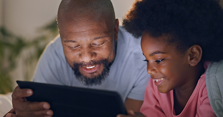 Image showing Father, child and tablet in bedroom at night watching cartoons and in bed with technology and laugh. Happy, enjoying and online for videos, digital and internet in home streaming or bonding together