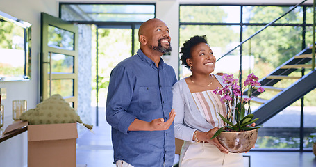 Image showing Couple, flowers and happy in new home or real estate with property investment, fresh start and support. Black people, man and woman with pot plant for moving, mortgage and excited for achievement