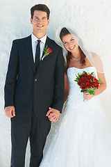 Image showing Portrait, happy couple and holding hands at wedding with bouquet of roses, love and commitment at reception. Flowers, woman and man at marriage celebration with smile, loyalty and future together.