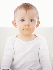 Image showing Home, bed and portrait of baby relax, resting and calm in nursery for sleeping or wake up in morning. Family, youth and face of infant newborn in bedroom for child development, growth and wellness