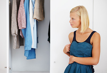 Image showing Woman, mirror or choosing clothes in closet for morning routine, fashion or clothing in bedroom of home. Person, outfit selection or decision for dress, garment idea or style in wardrobe or apartment