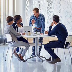 Image showing Business people, meeting or discussion with brainstorming for planning, collaboration and technology at table. Employees, men or women at corporate workplace with communication and speaker or smile.