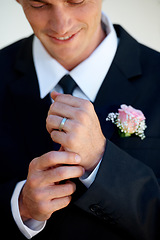 Image showing Groom man, ring and smile for wedding, celebration or commitment to relationship, thinking or pride. Person, gold jewelry and tuxedo suit for marriage, happy and hands at event, party or reception