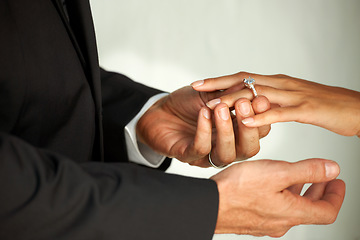 Image showing Couple, bride and ring on hand, commitment and love at wedding, promise and loyalty in marriage. Newlyweds, jewelry and faith or trust in relationship, hope and partnership in closeup of support