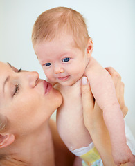 Image showing Mother, family and kiss baby with love for trust, care support and health wellness for parent happiness. Woman, smile or cute newborn with blonde hair, blue eyes or gratitude connect or mama bonding