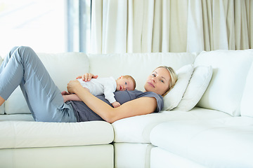 Image showing Relax, home and sofa, mother and baby bonding, woman and kid lying in living room together. Calm morning, mom and newborn on couch for rest, love and family security, comfort and child care in lounge