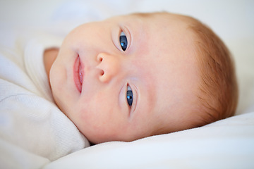 Image showing Closeup, portrait and baby for wake up in bedroom for sleep, relax or peaceful in morning. Infant, happy or good dream from nap with calm, care or hope for child growth, cognitive and development