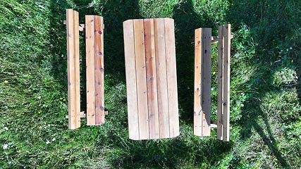 Image showing Rustic wooden picnic table in the backyard top view