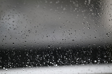 Image showing Water drops on fogged glass with a gray brightness gradient