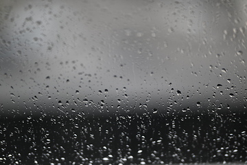 Image showing Water drops on fogged glass with a gray brightness gradient