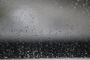 Image showing Water drops on fogged glass with a gray brightness gradient