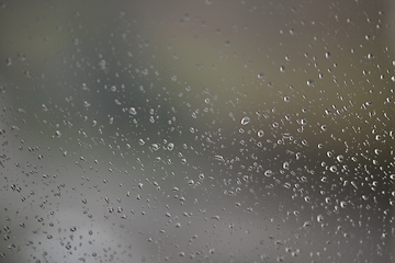 Image showing Water drops on fogged glass with a gray brightness gradient