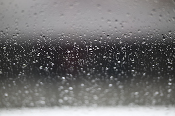 Image showing Water drops on fogged glass with a gray brightness gradient